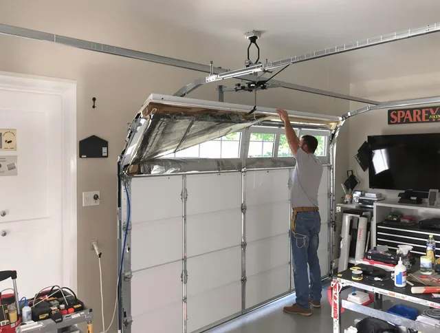 Garage door section replacement by Raynham Garage Door Repair in Raynham