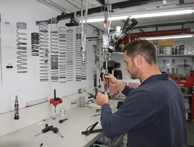 Raynham Garage Door Repair safety certified technician performing precision spring replacement in Raynham