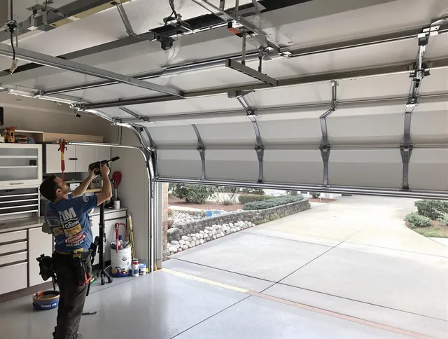Garage door track repair service by Raynham Garage Door Repair in Raynham